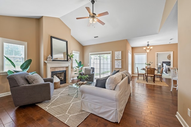 328 Hidden Creek Cir, Dothan, AL 36301 - living room with a tile fireplace, dark wood-type flooring, a chandelier, a ceiling fan, and high vaulted ceiling