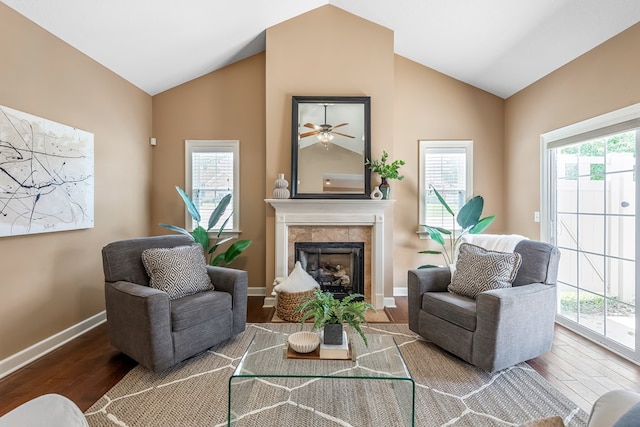 328 Hidden Creek Cir, Dothan, AL 36301 - living area featuring vaulted ceiling, wood finished floors, a tile fireplace, and a ceiling fan
