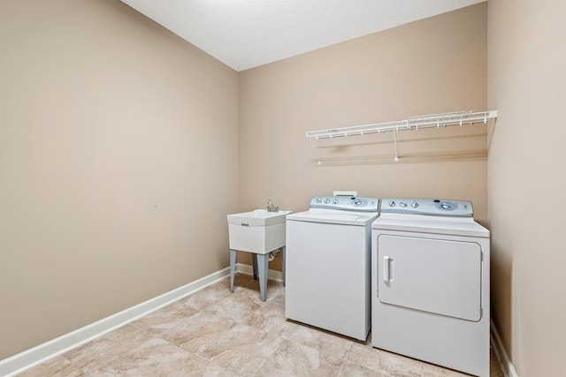328 Hidden Creek Cir, Dothan, AL 36301 - laundry room with washer and dryer and baseboards