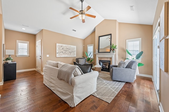 328 Hidden Creek Cir, Dothan, AL 36301 - living area featuring a glass covered fireplace, dark wood-type flooring, a ceiling fan, lofted ceiling, and recessed lighting