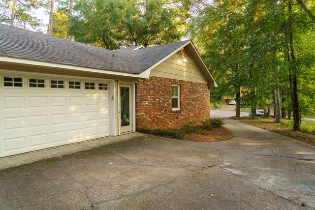 view of side of property with a garage