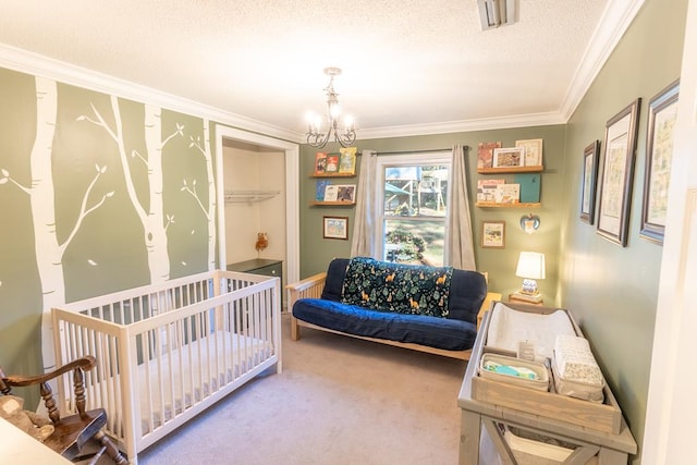 bedroom with carpet, a textured ceiling, ornamental molding, and a notable chandelier