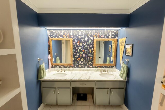 bathroom featuring tile patterned floors, crown molding, and vanity