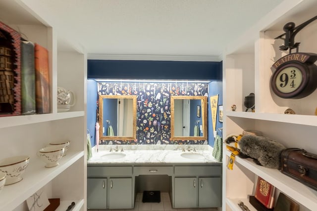 bathroom with tile patterned floors, crown molding, and vanity