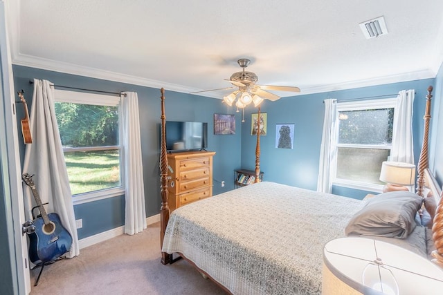 bedroom featuring light colored carpet, ceiling fan, and ornamental molding