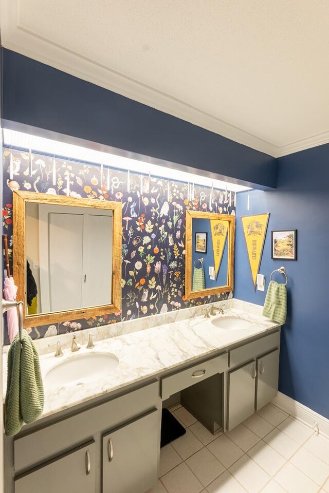 bathroom with tile patterned flooring, vanity, and crown molding