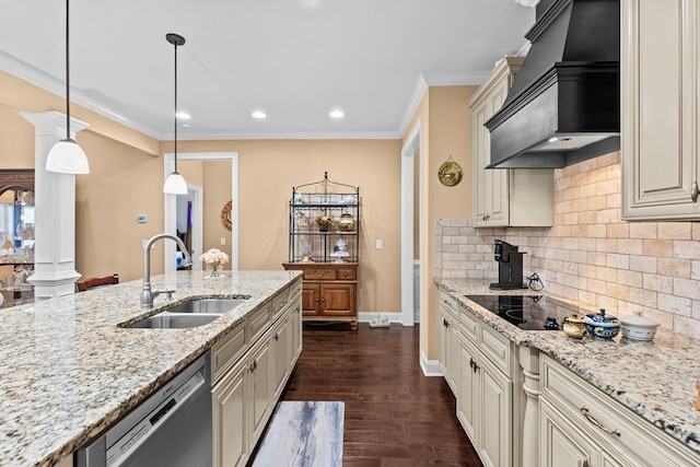 kitchen featuring light stone countertops, premium range hood, dishwashing machine, pendant lighting, and sink