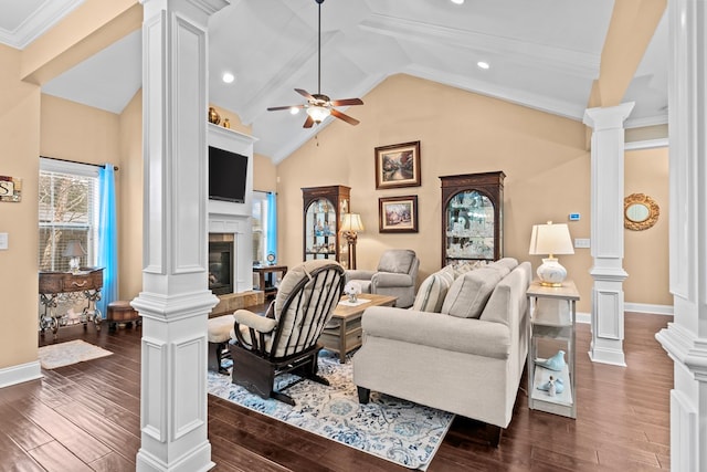 living room featuring a tile fireplace, lofted ceiling, ceiling fan, crown molding, and dark wood-type flooring