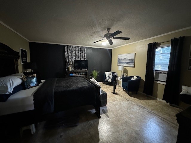 bedroom with a textured ceiling, hardwood / wood-style flooring, ceiling fan, and ornamental molding