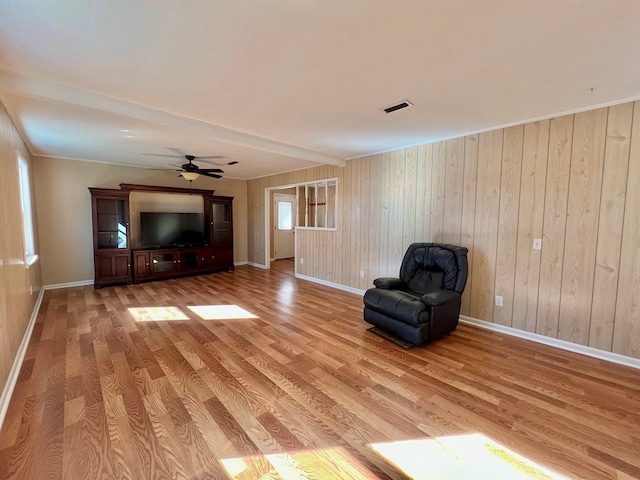 unfurnished room featuring ceiling fan and light hardwood / wood-style flooring