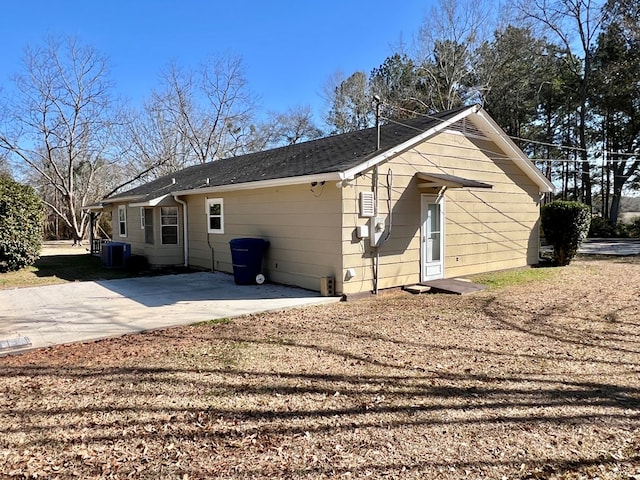back of house with cooling unit and a patio area