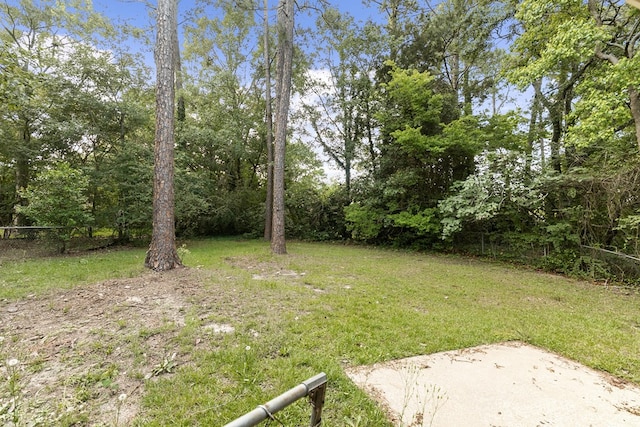 view of yard with fence and a patio