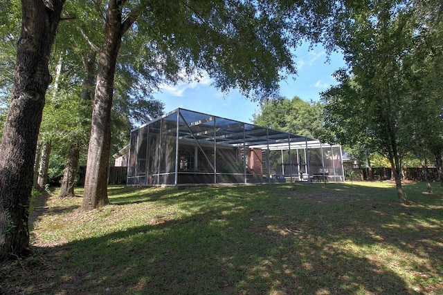 view of yard featuring glass enclosure