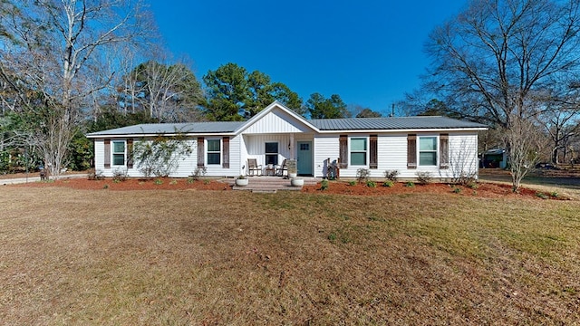 ranch-style home with a porch and a front lawn