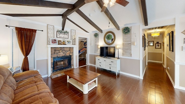 living room featuring dark hardwood / wood-style flooring, a stone fireplace, and lofted ceiling with beams