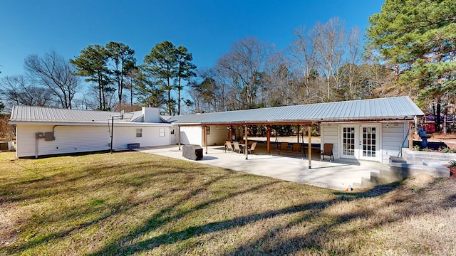 rear view of house featuring a yard, a patio area, french doors, and central air condition unit