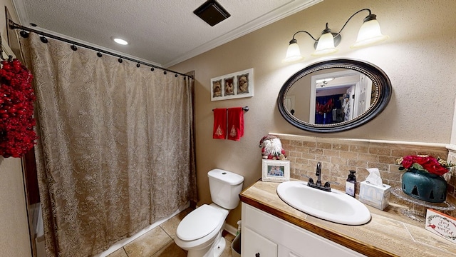 bathroom with crown molding, tile patterned flooring, vanity, a textured ceiling, and toilet