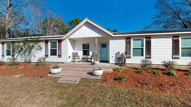 ranch-style home with covered porch