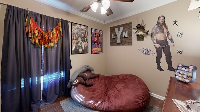 bedroom featuring ceiling fan, ornamental molding, and wood-type flooring