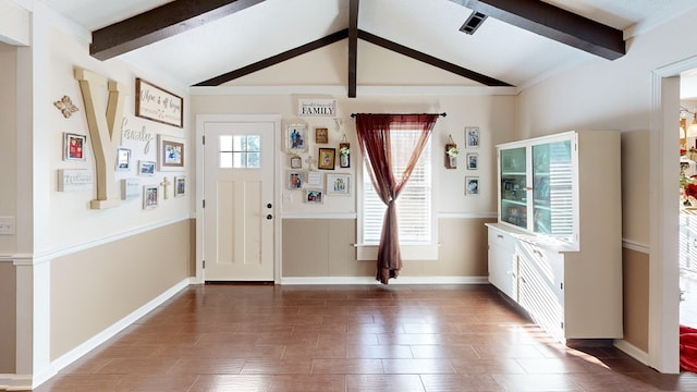 foyer entrance with lofted ceiling with beams