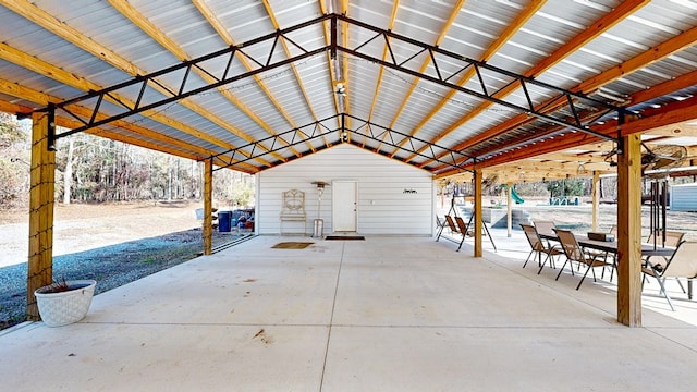 view of patio / terrace with an outbuilding