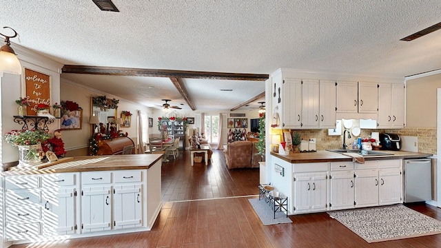 kitchen featuring sink, dark wood-type flooring, dishwasher, white cabinetry, and tasteful backsplash