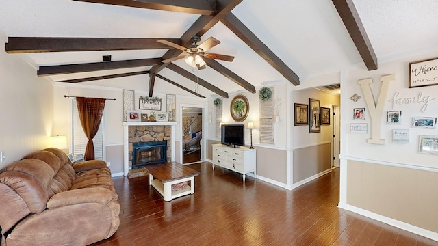 living room featuring dark hardwood / wood-style flooring, a stone fireplace, lofted ceiling with beams, and ceiling fan