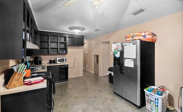 kitchen featuring a textured ceiling, ceiling fan, and stainless steel refrigerator with ice dispenser