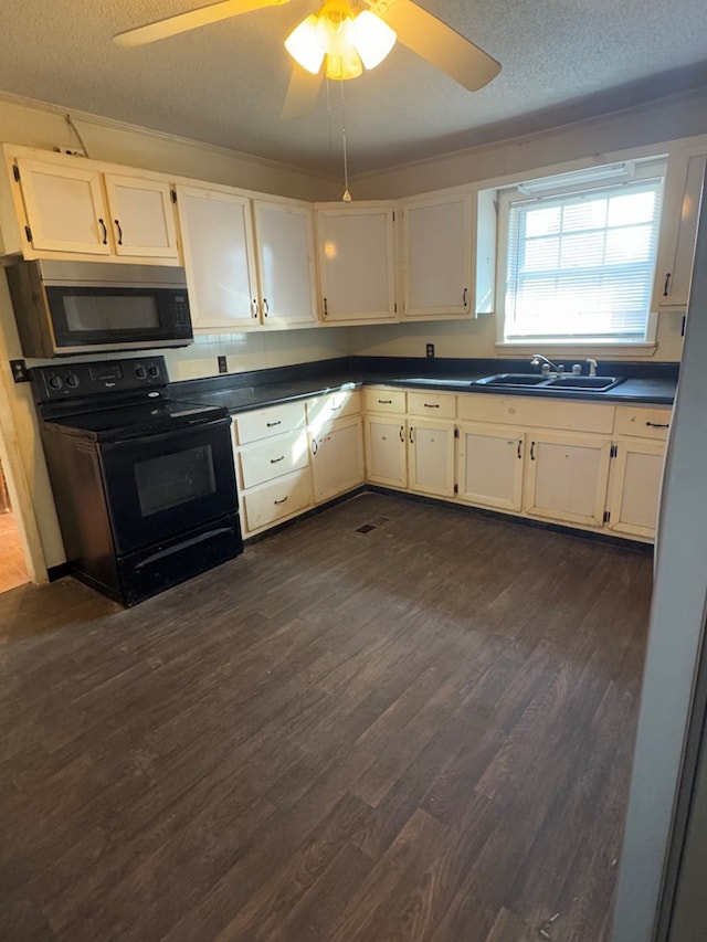 kitchen with electric range, sink, dark hardwood / wood-style flooring, and white cabinetry