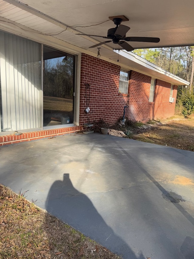 view of patio featuring ceiling fan