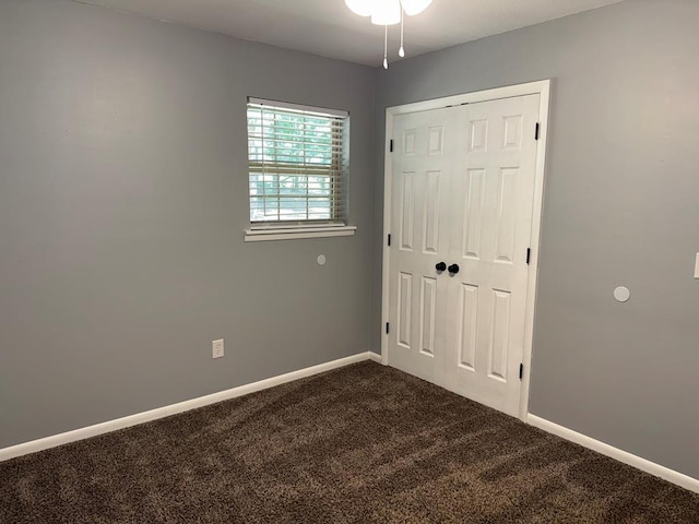 471 Faith St, Enterprise, AL 36330 - unfurnished bedroom featuring dark carpet and a closet