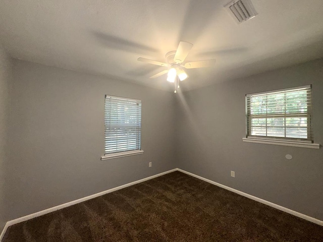 471 Faith St, Enterprise, AL 36330 - spare room with dark carpet and ceiling fan
