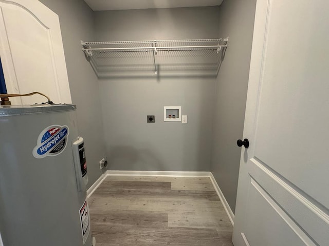 471 Faith St, Enterprise, AL 36330 - washroom with water heater, hookup for an electric dryer, wood finished floors, and hookup for a washing machine