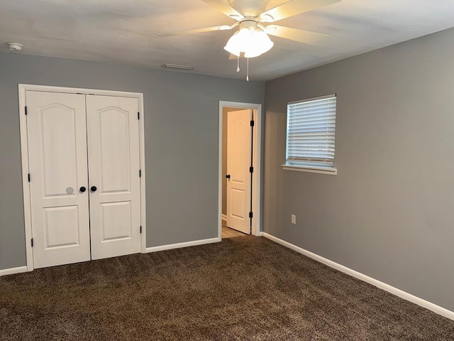 471 Faith St, Enterprise, AL 36330 - unfurnished bedroom with carpet floors, a closet, and a ceiling fan
