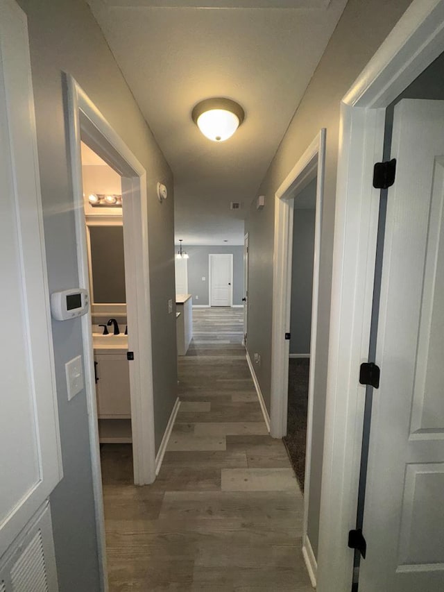 471 Faith St, Enterprise, AL 36330 - hallway with dark wood-style flooring and baseboards