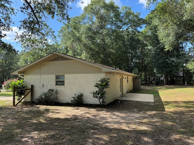 471 Faith St, Enterprise, AL 36330 - view of side of home with brick siding and view of wooded area