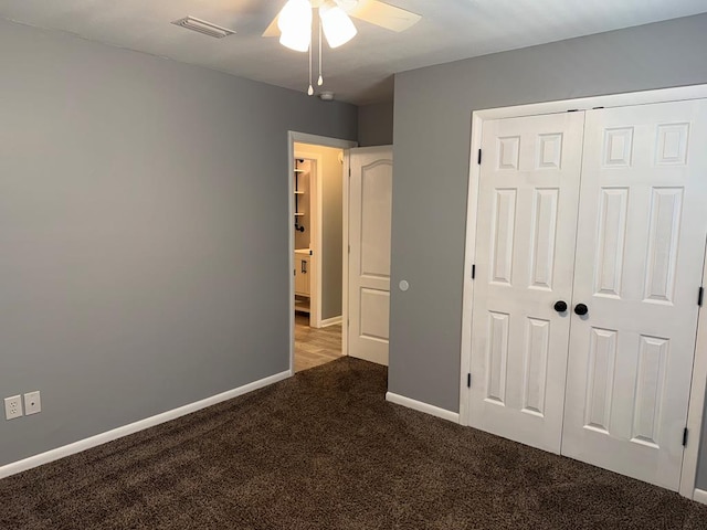 471 Faith St, Enterprise, AL 36330 - unfurnished bedroom with carpet, a closet, and a ceiling fan