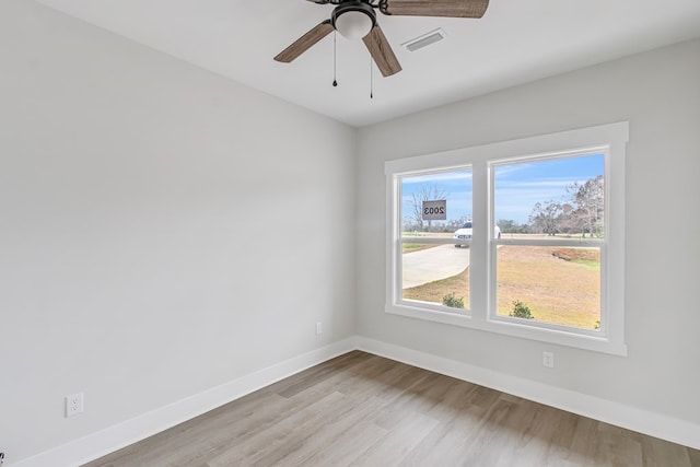 spare room with ceiling fan and light hardwood / wood-style flooring