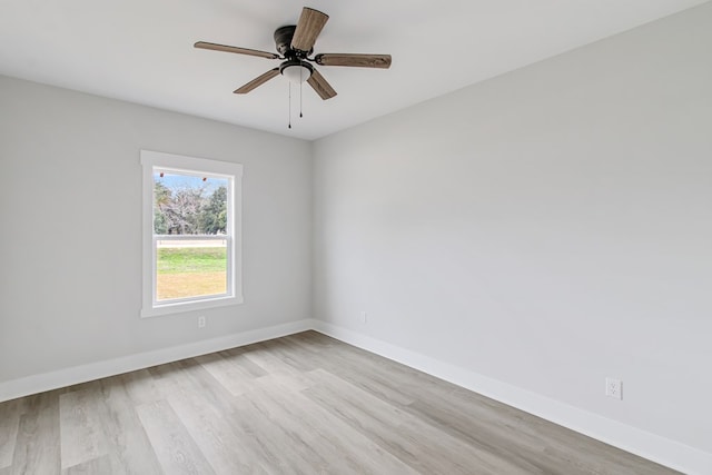 spare room with light hardwood / wood-style flooring and ceiling fan