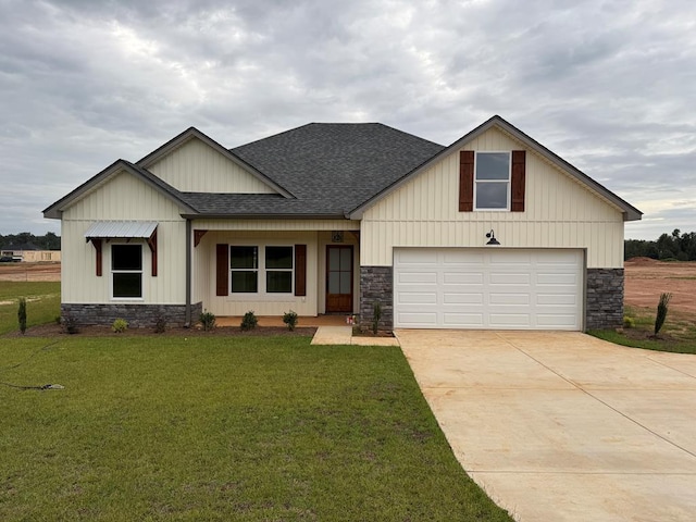 view of front of house with a front lawn and a garage