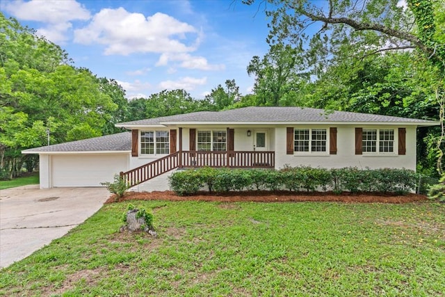 ranch-style home with concrete driveway, a front lawn, an attached garage, and a porch