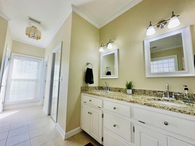 bathroom with vanity, tile patterned floors, and crown molding