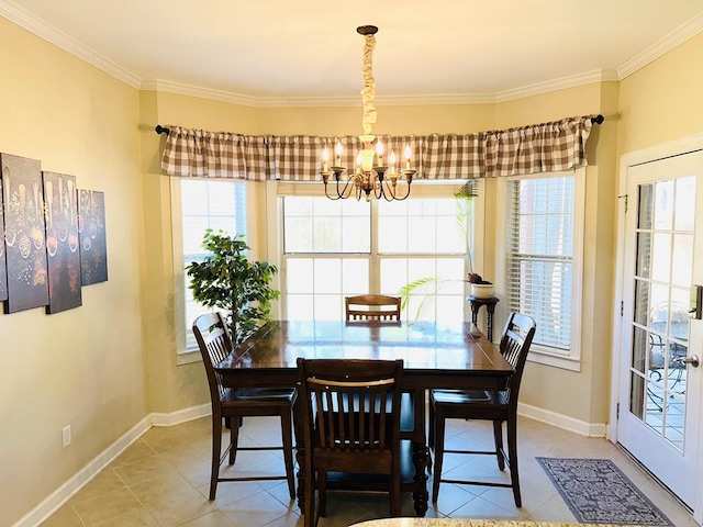 dining room featuring tile patterned floors, crown molding, and an inviting chandelier