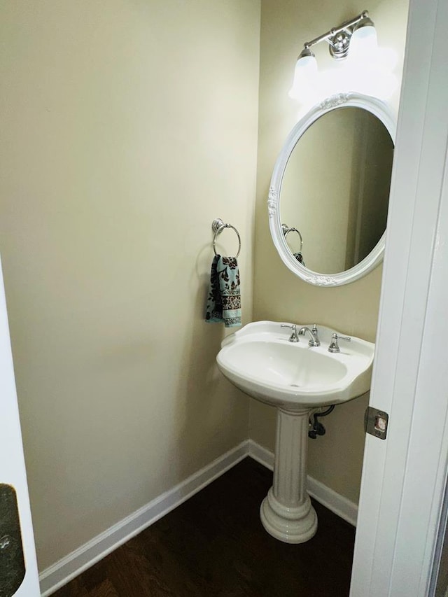 bathroom featuring hardwood / wood-style flooring and sink