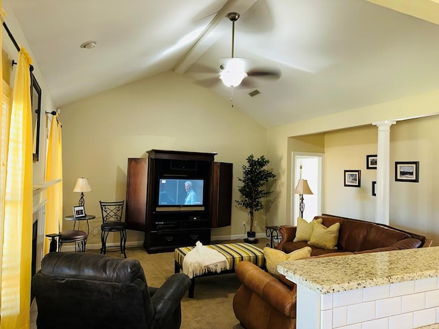 living room with ornate columns, ceiling fan, lofted ceiling with beams, light carpet, and a fireplace