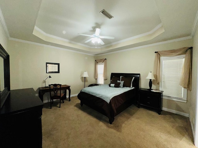 bedroom with light colored carpet, a raised ceiling, ceiling fan, and crown molding