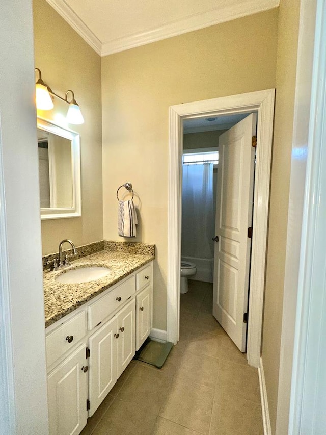 bathroom featuring toilet, vanity, tile patterned floors, and crown molding