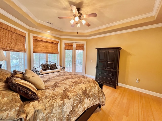 bedroom featuring access to exterior, light hardwood / wood-style floors, ceiling fan, and ornamental molding