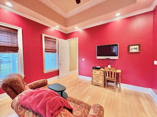 living room with hardwood / wood-style floors and crown molding