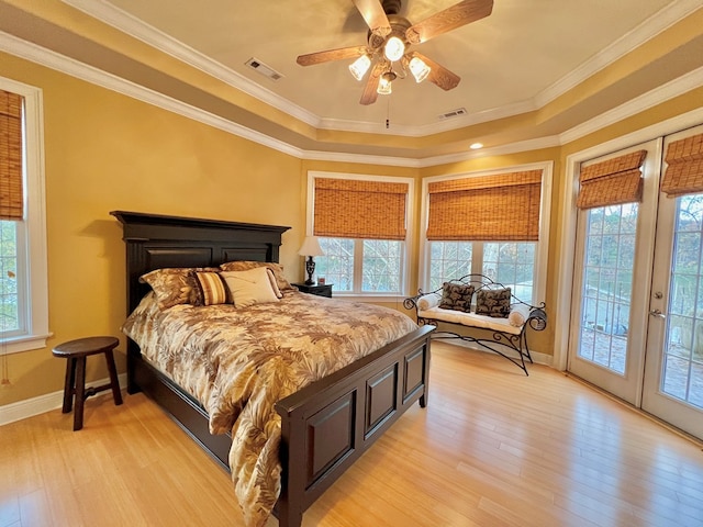 bedroom with multiple windows and crown molding